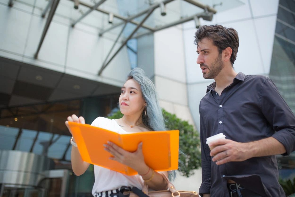 Developers reviewing GIS printouts from their map plotter printer