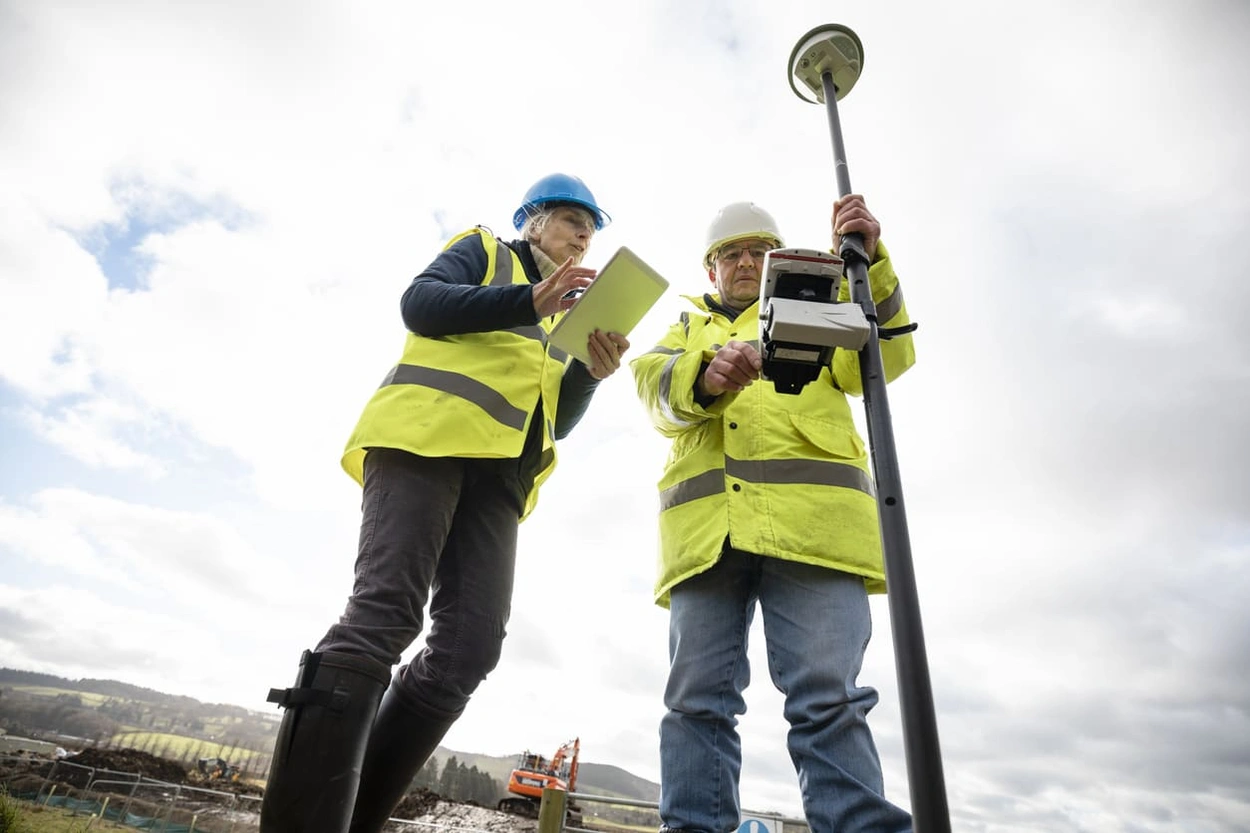 Professionals collecting GIS data for finely detailed GIS output