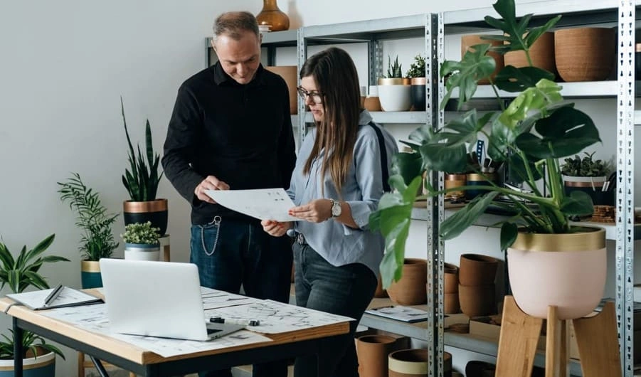 Coworkers completing a project with more sustainable printing options