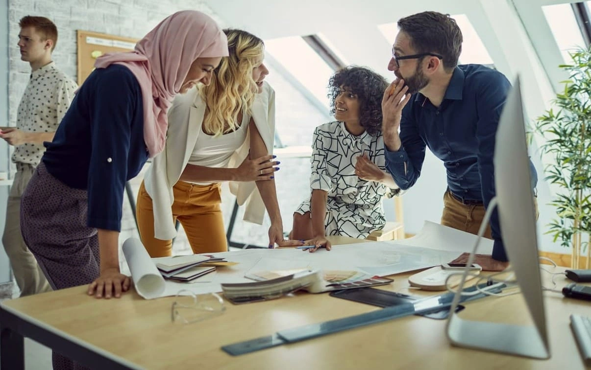 Happy AEC team quickly completing a new project with the help of a fast architectural plotter printer