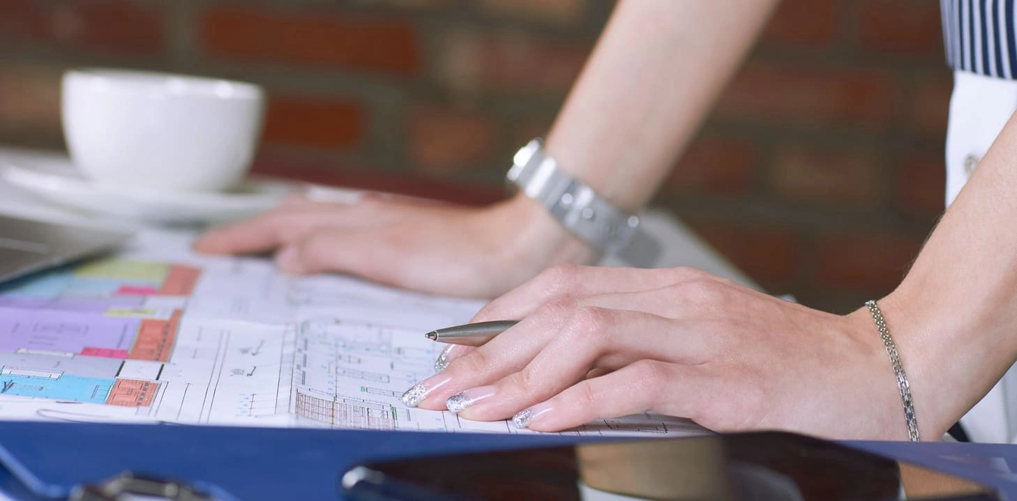 Architect working on a plan printed from color plotter printers