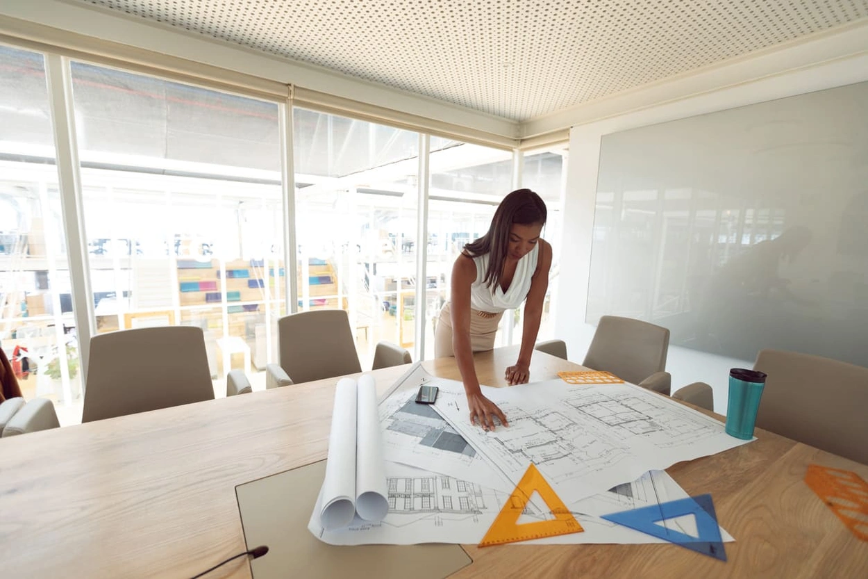Architect looking at detailed blueprints made with thermal inkjet printing