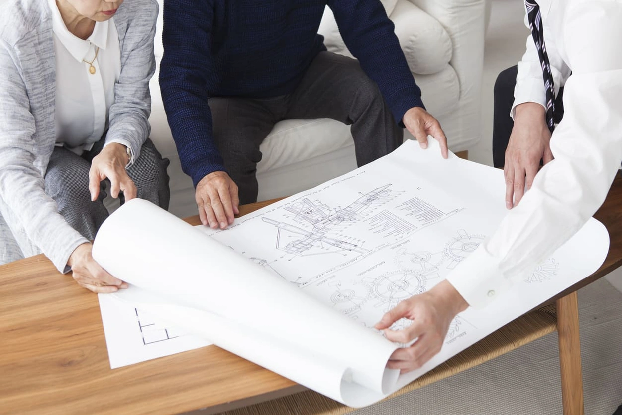 Employee sharing detailed printouts with coworkers