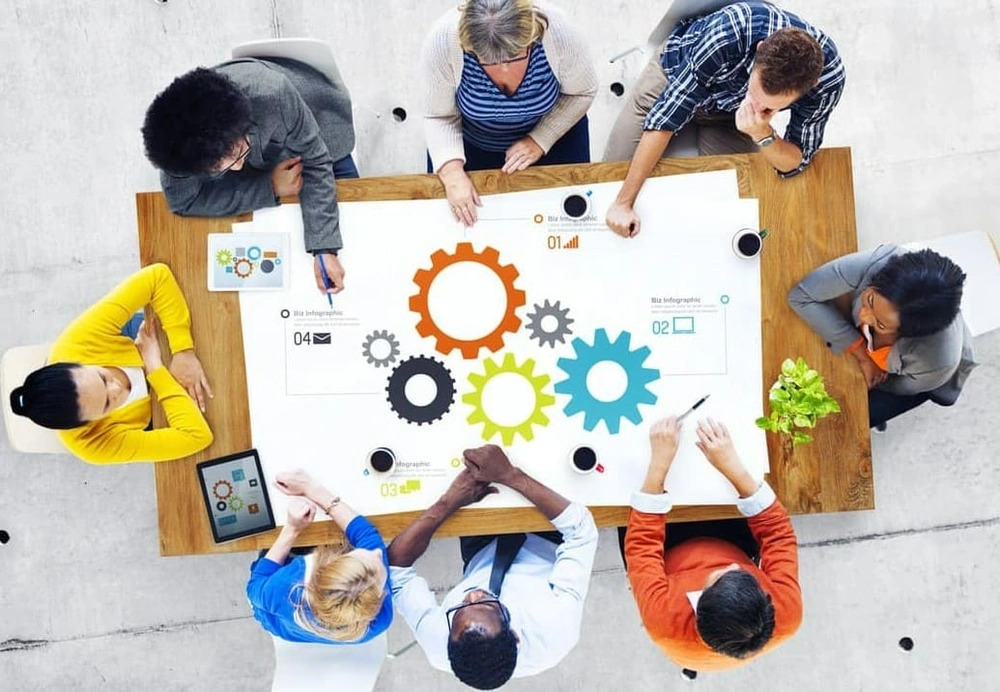 Marketing team creating in-house posters with a professional large format printer