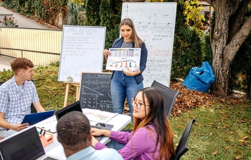 Student practising a thesis presentation after using student poster printing at the school
