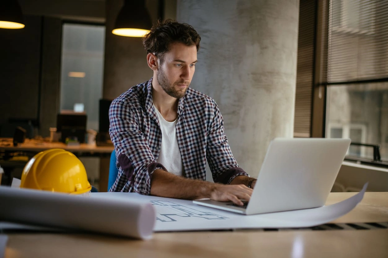 Technician running diagnostic software to make a plotter printer last longer