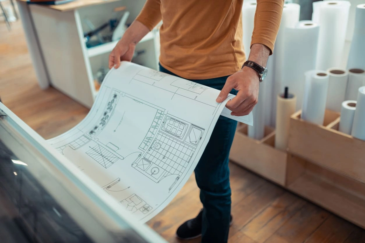 Architect printing floorplans with an in-office plotter printer