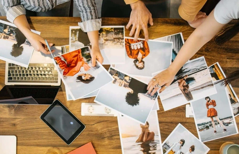 Marketers assessing printouts after changing their colour gamut settings Marketers assessing printouts after changing their colour gamut settings