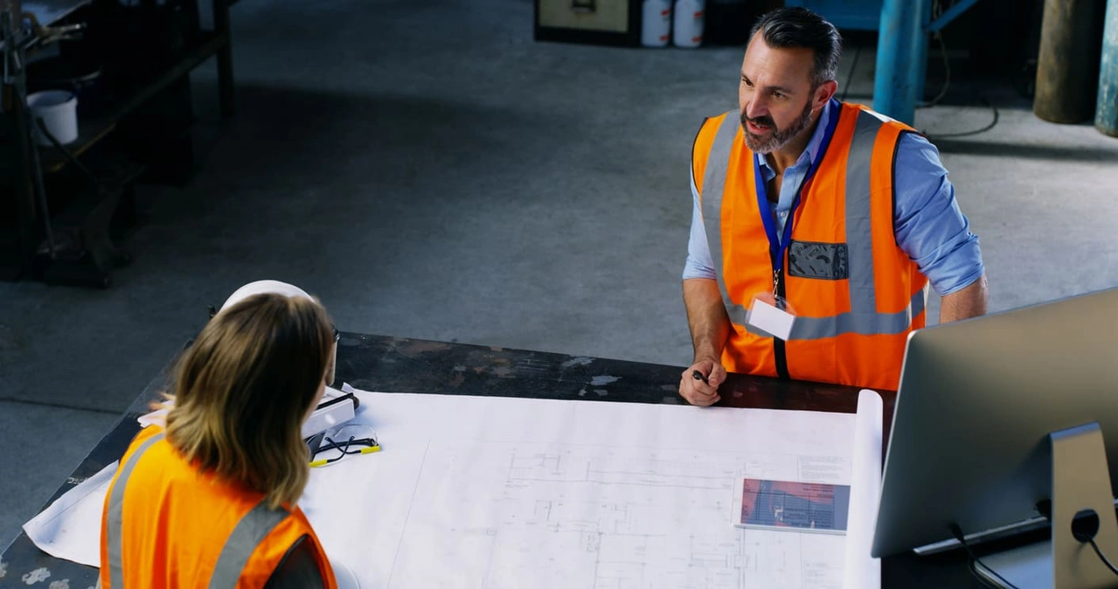 Workers using updated documentation after getting facility management printing resources Workers using updated documentation after getting facility management printing resources