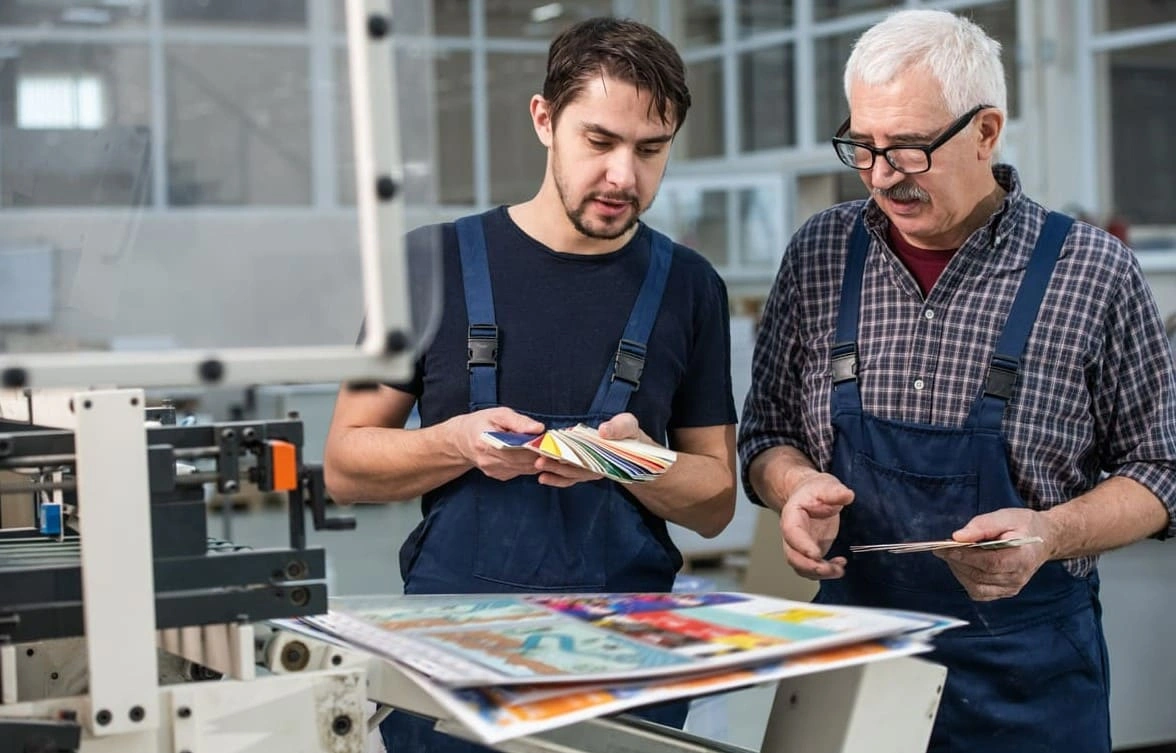 Printing experts verifying the colours of prints that used RIP software