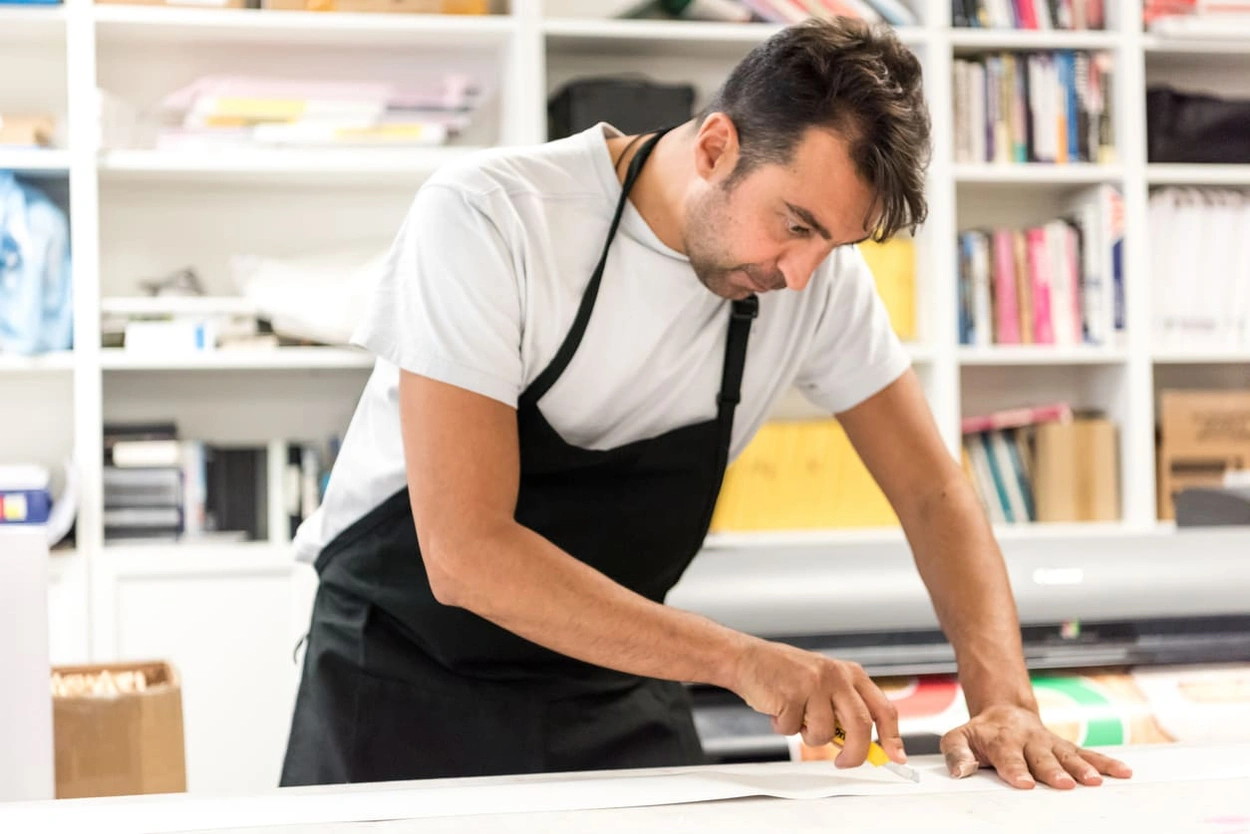 Print shop employee providing excellent service Print shop employee providing excellent service