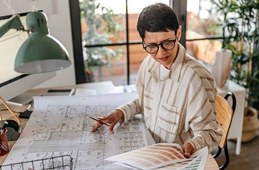 Designer using clear printouts with accurate colors after implementing practices with new A0 printing tips