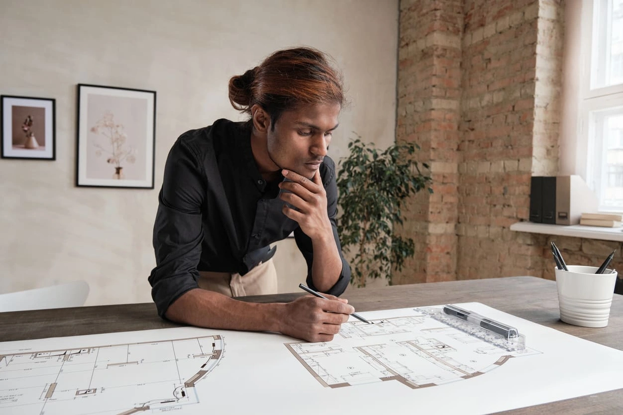 Architect reviewing a complex architecture landscape plan