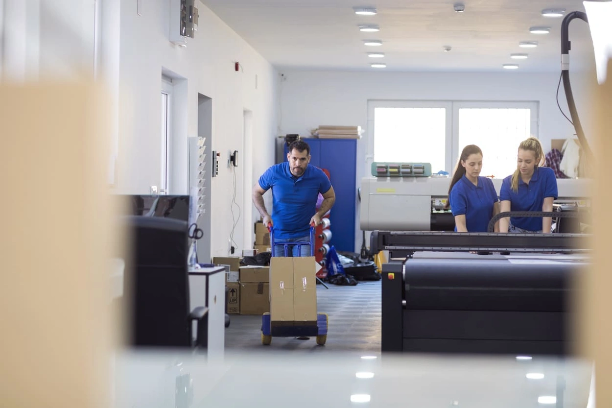 Print shop employees working productively and contributing to effective print management