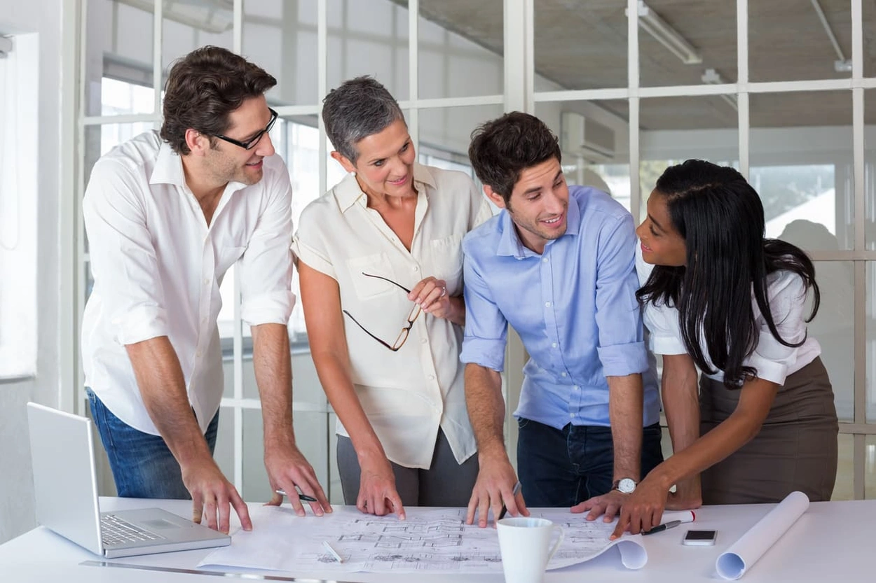 Coworkers seeing crisper prints after fixing blurry blueprint printing issues Coworkers seeing crisper prints after fixing blurry blueprint printing issues