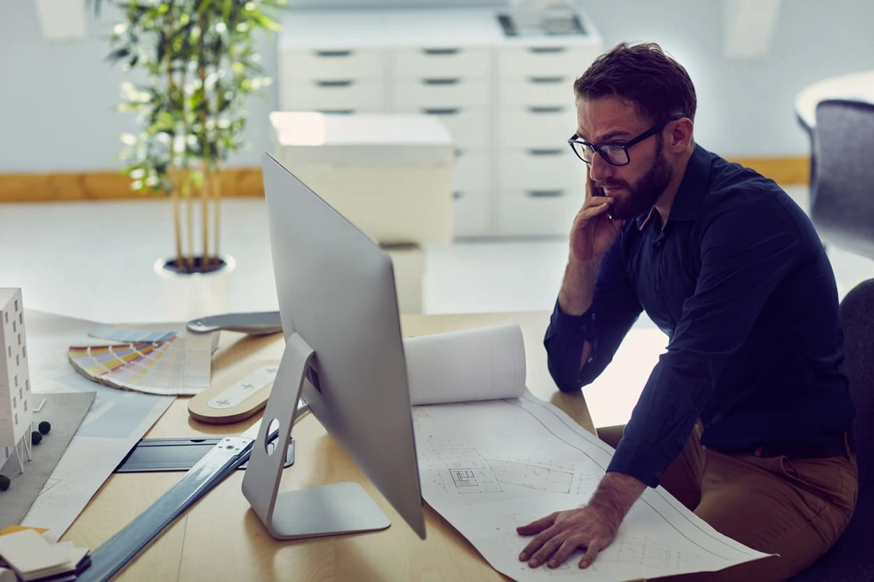 AEC professional ensuring he uses the right large document format to capture required details AEC professional ensuring he uses the right large document format to capture required details