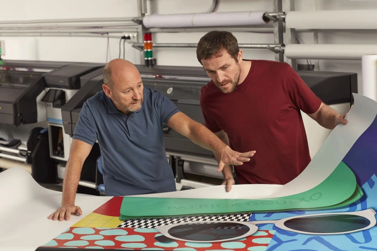 Professionals working in a print shop Professionals working in a print shop