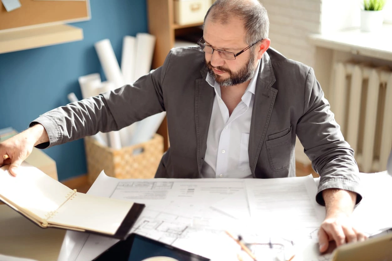 Executive determining typical print costs to determine next steps in reducing printing costs Executive determining typical print costs to determine next steps in reducing printing costs