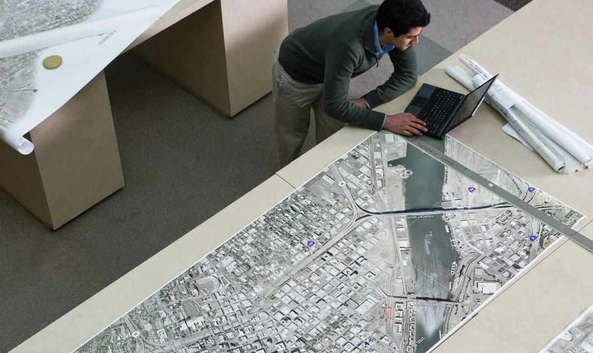AEC professional conducting GIS printing to produce large maps